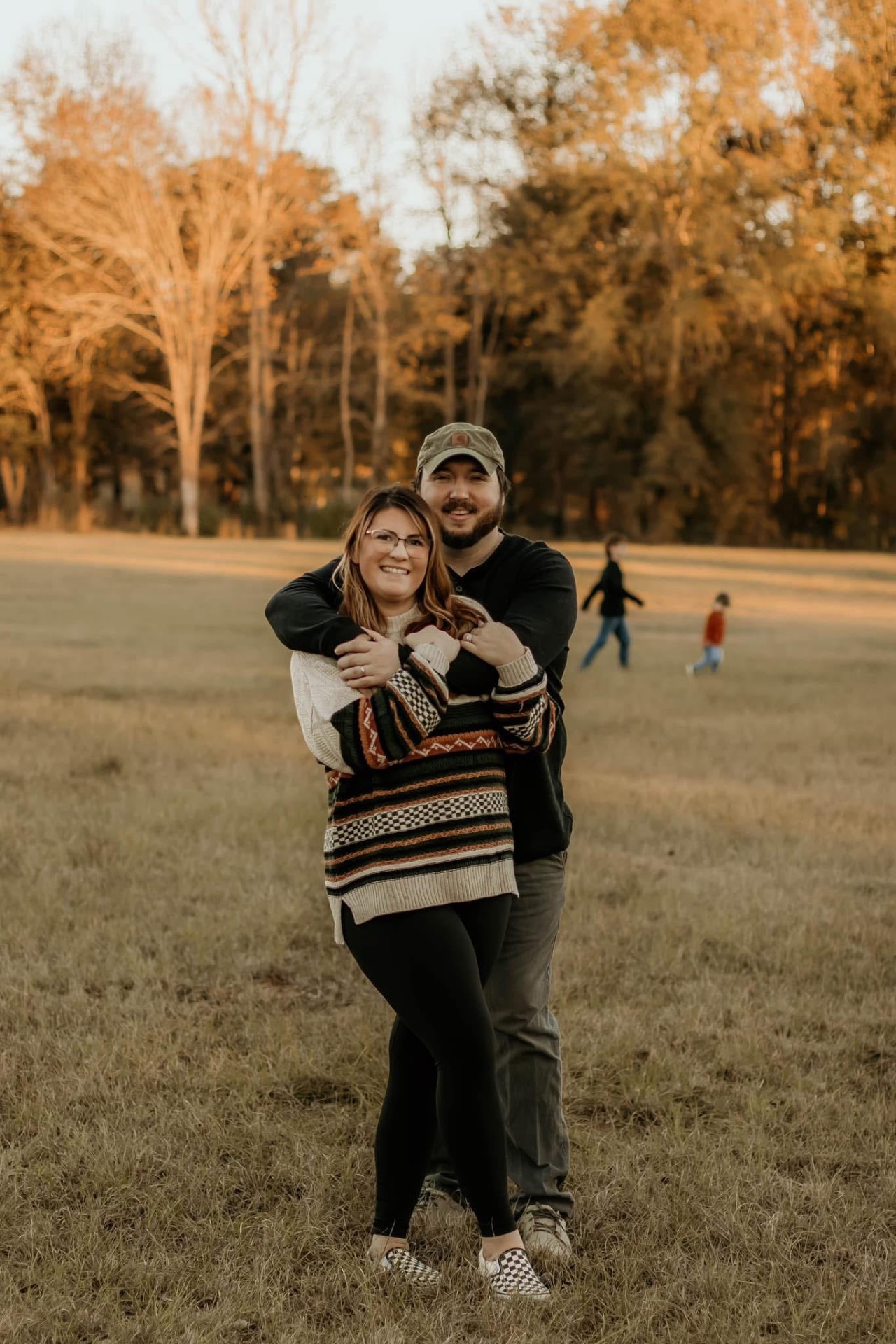 Brianna and her partner outdoors at golden hour
